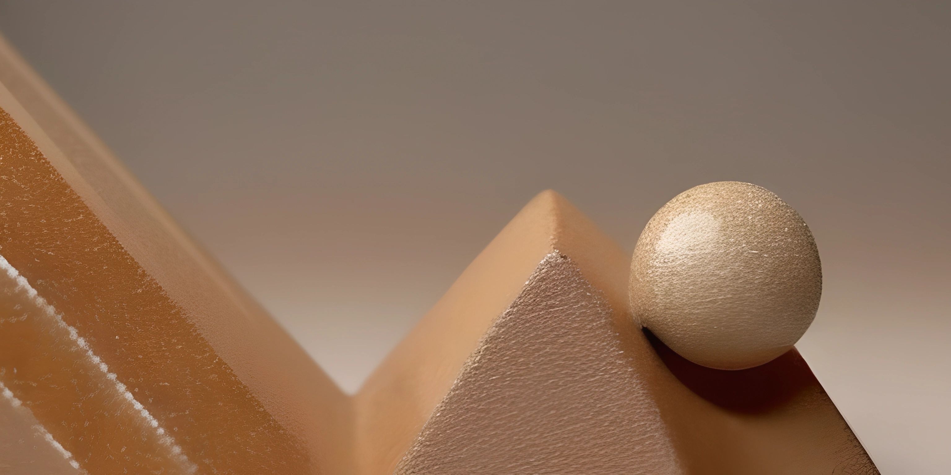 a white egg with a golden ball on top of it next to a piece of cardboard