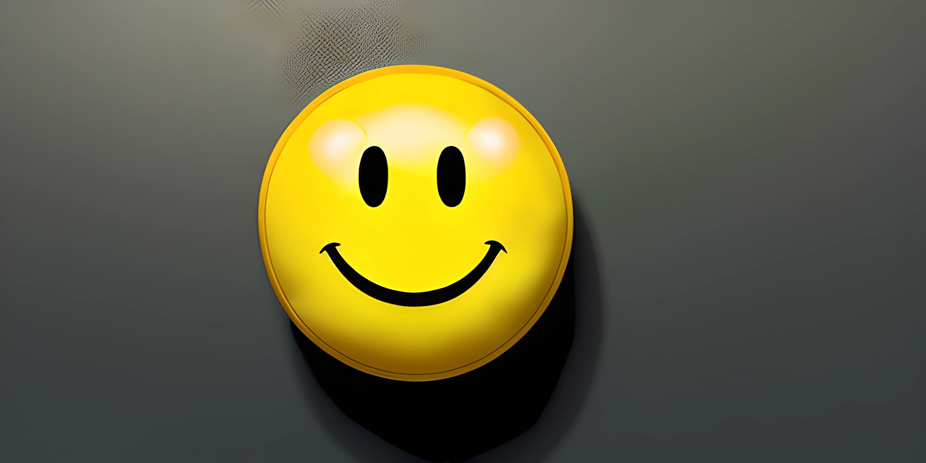 a yellow smiley face with three eyes on the surface of a surface of cement with a blurry background