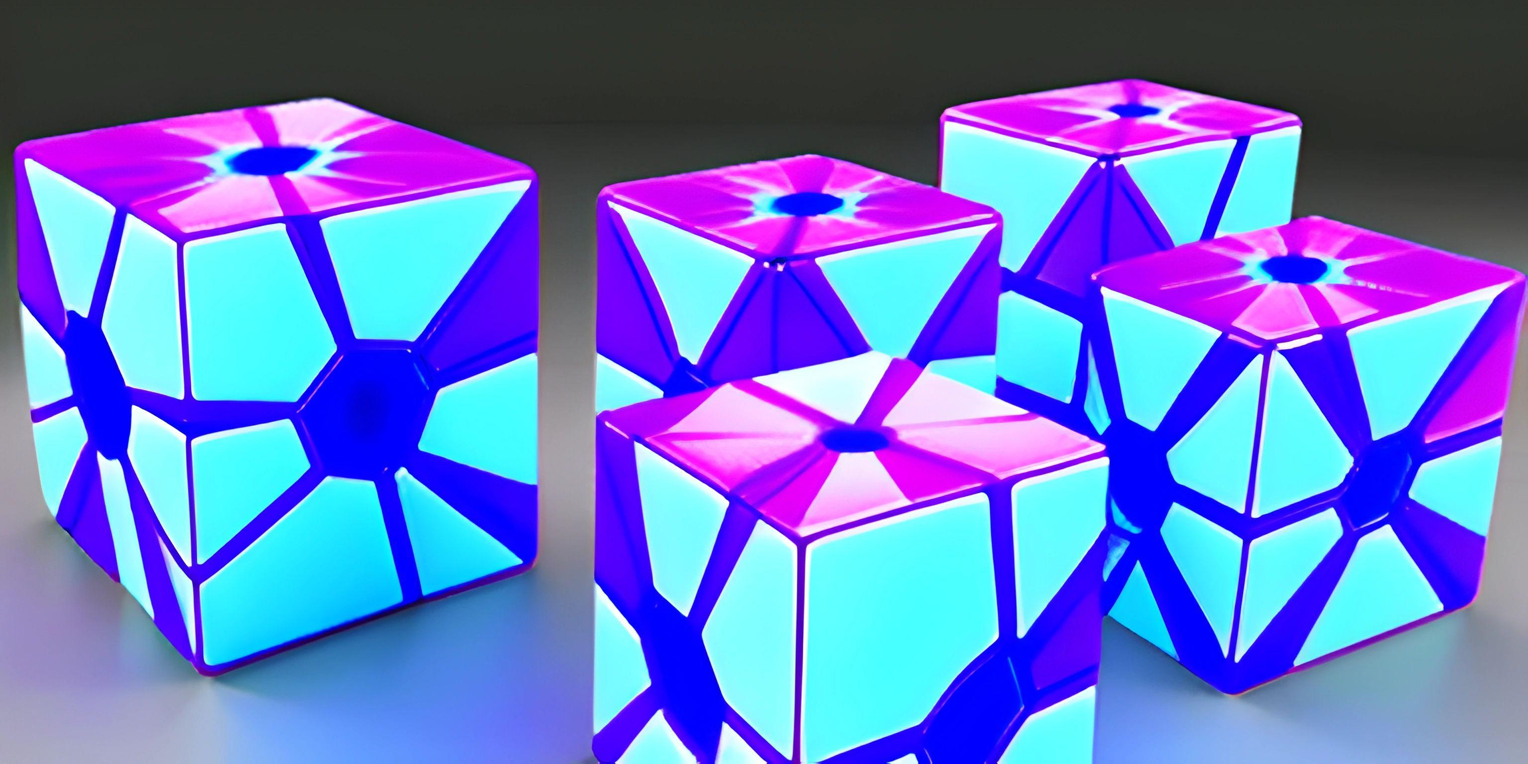 a number of cubes with some blue and pink designs on it sitting on a table