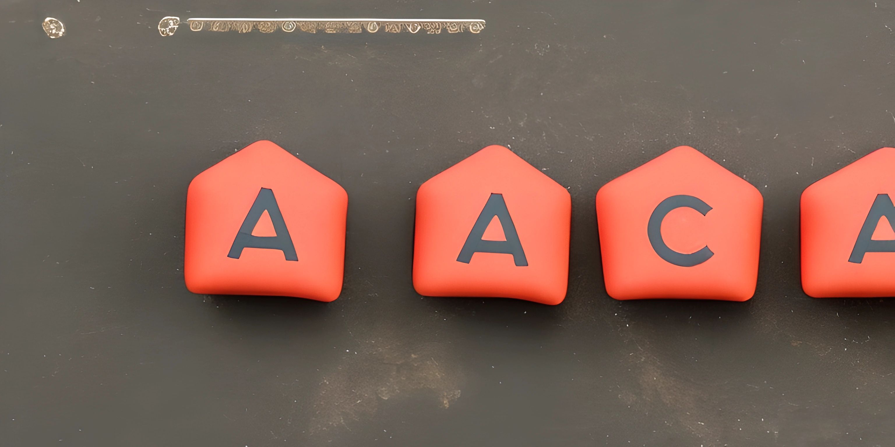 four red buoys attached to the wall above an aca sign on a black surface